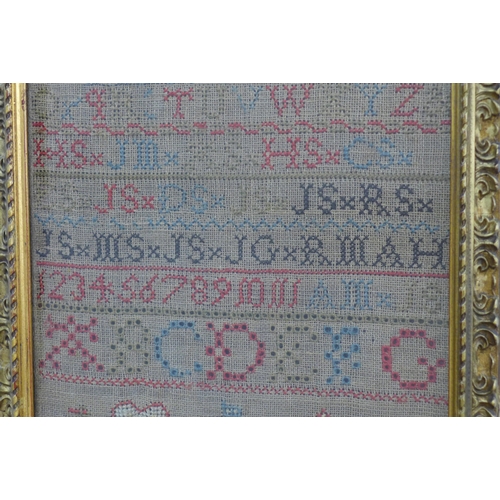 380 - Alphabet and house needlework sampler, framed under glass 22 x 43cm