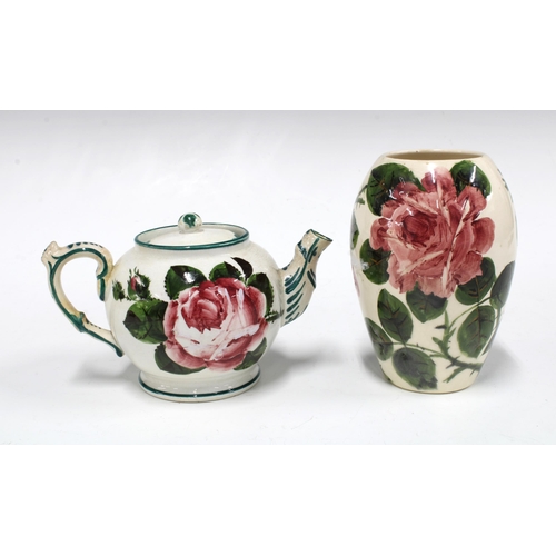 111 - Wemyss ware handpainted cabbage rose pottery to include a pair of chamber candlesticks and small tea... 