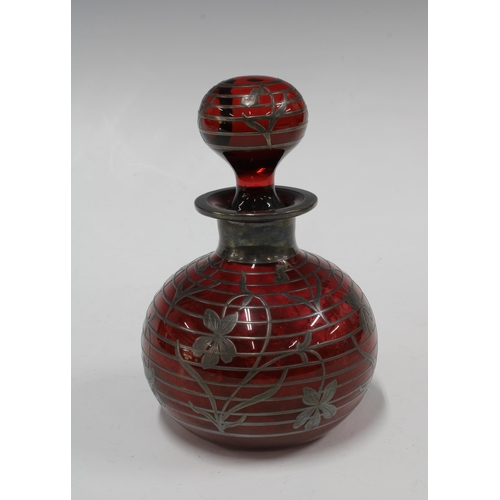 115 - Ruby glass and silver overlay scent bottle and stopper, 11 x 17cm.