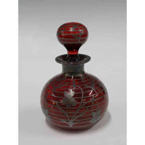 115 - Ruby glass and silver overlay scent bottle and stopper, 11 x 17cm.