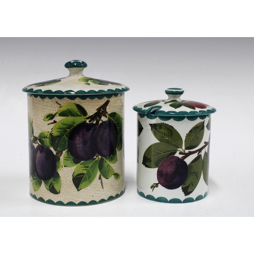 119 - Two Wemyss Ware preserve jars with covers, handpainted plums pattern, with painted marks, the larger... 