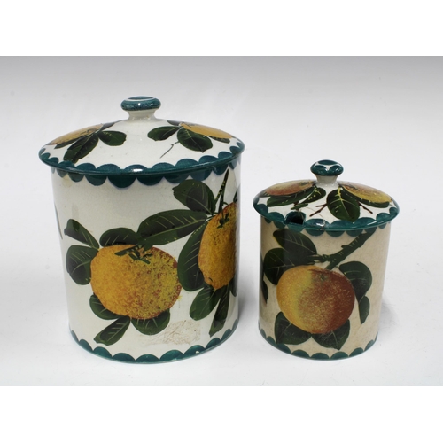 122 - Two Wemyss Ware preserve jars with covers, handpainted oranges pattern, impressed and painted marks ... 