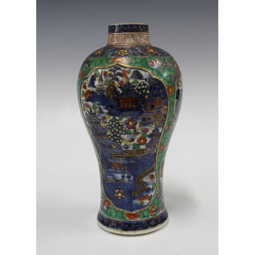 132 - Chinese clobbered porcelain vase, underglaze blue and white panels with pagoda pattern, 12 x 24cm.