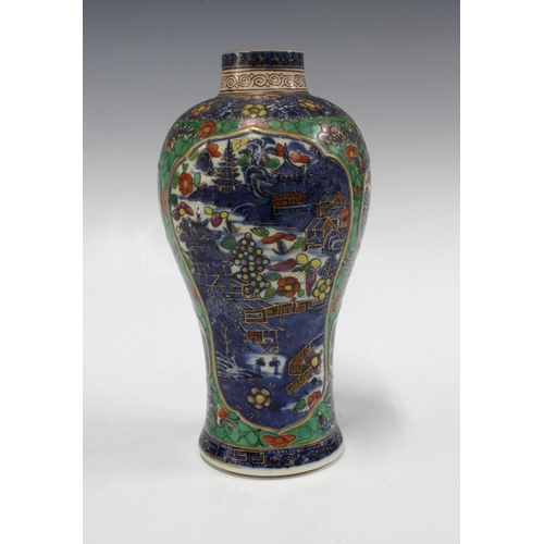 132 - Chinese clobbered porcelain vase, underglaze blue and white panels with pagoda pattern, 12 x 24cm.