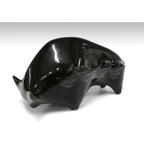 139 - Black glazed pottery bull, 35 x 15cm.