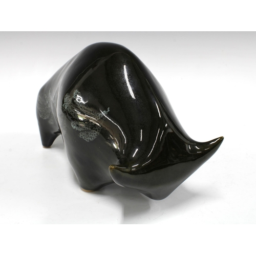 139 - Black glazed pottery bull, 35 x 15cm.