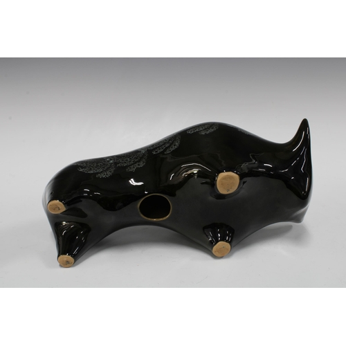 139 - Black glazed pottery bull, 35 x 15cm.