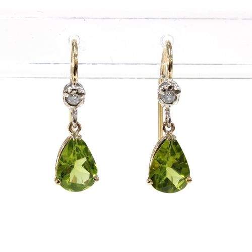 15 - A pair of peridot and diamond drop earrings, each set with a bright cut diamond above a pear shaped ... 