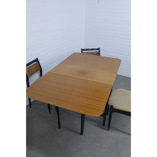 202 - Mid century tola wood dining table and four chairs, drop leaf table by Lebus,  151 x 77 x 91cm. (5)