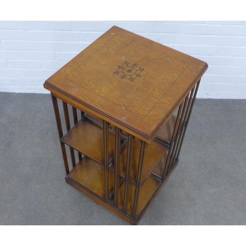 208 - An inlaid mahogany revolving bookcase, 46 x 86cm.