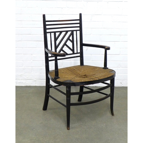 209 - An Aesthetic Movement ebonised open armchair, after E.W Godwin, Cockpen back and woven rush seat, 54... 