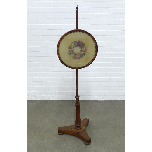 212 - 19th century mahogany pole screen, on a platform base, 139cm high.