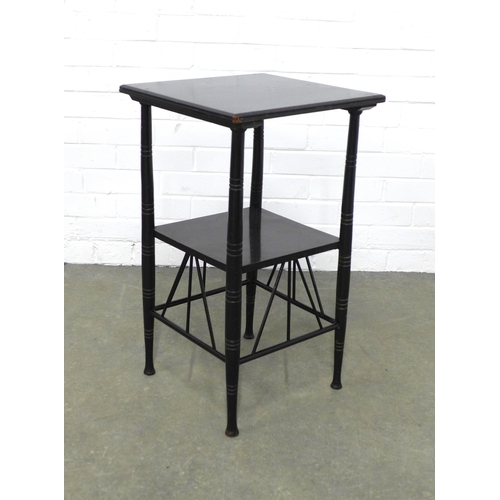 242 - Manner of E. W. Godwin (British, 1833-1886) an ebonised two tier table, 40 x 67 x 39cm.