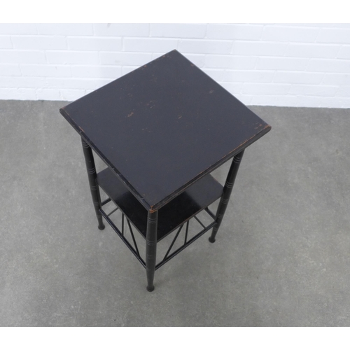 242 - Manner of E. W. Godwin (British, 1833-1886) an ebonised two tier table, 40 x 67 x 39cm.