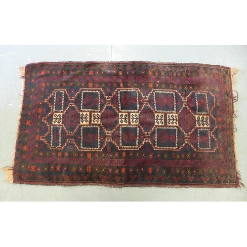 281 - Baluch rug with red field, 178 x 100cm.