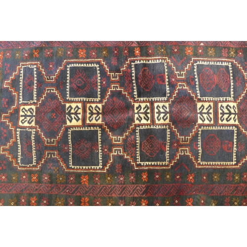 281 - Baluch rug with red field, 178 x 100cm.