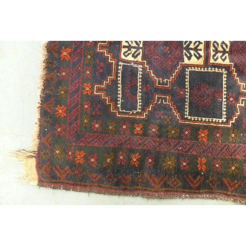 281 - Baluch rug with red field, 178 x 100cm.