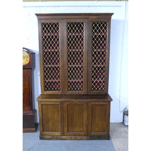 286 - Large 19th century stained pine bookcase cabinet,  the three cupboard doors with brass grills enclos... 