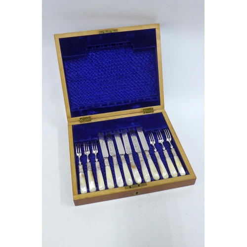 303 - Set of six mother of pearl and Epns fruit knives and forks in a mahogany canteen box, 30 x 25cm.