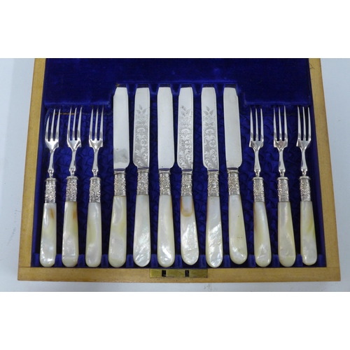 303 - Set of six mother of pearl and Epns fruit knives and forks in a mahogany canteen box, 30 x 25cm.