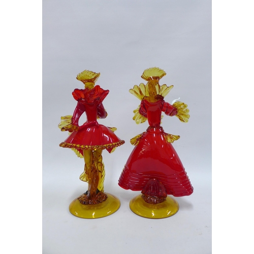 306 - A pair of Toffolo red glass figures of courtesans, one signed (2), 22 x 39cm.