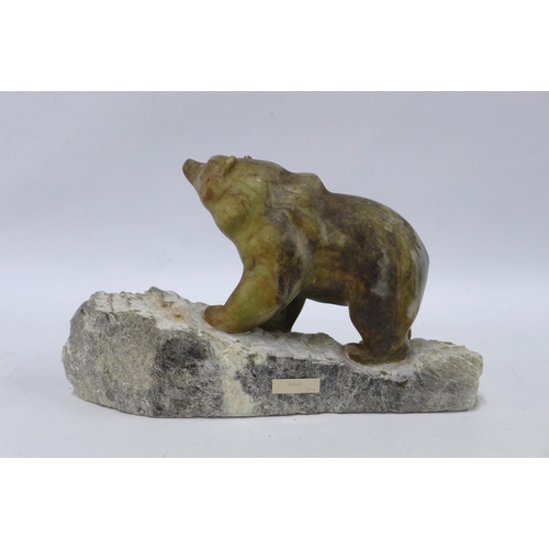 311 - A carved stone grizzly bear,  on a rocky base with name plaque 'Fran' 36cm.