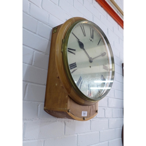 324 - Pine cased Station clock, circular enamel dial with Roman numerals, 42 x 55cm