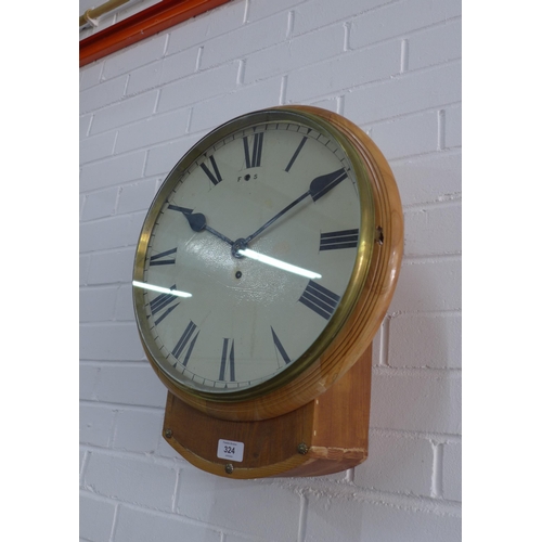 324 - Pine cased Station clock, circular enamel dial with Roman numerals, 42 x 55cm