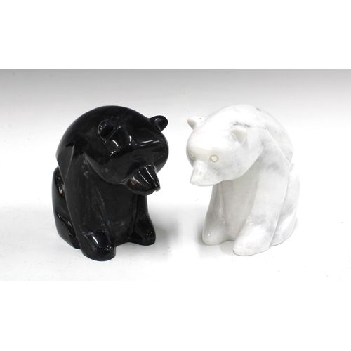 328 - A polished black stone polar bear and another in white veined stone (2) 18 x 16cm.