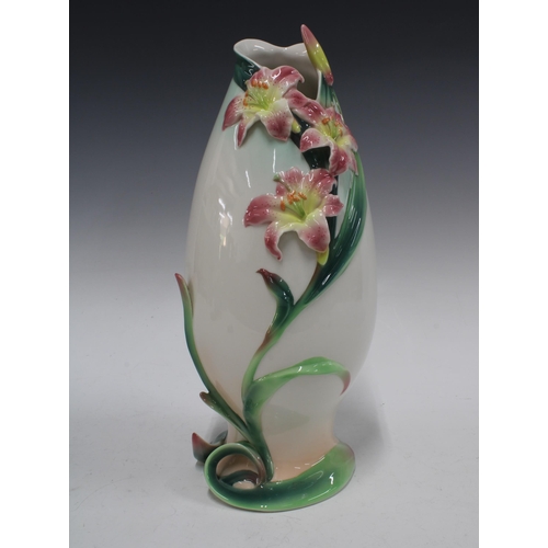 329 - Franz porcelain vase with stargazer lily pattern, 16 x 37cm.