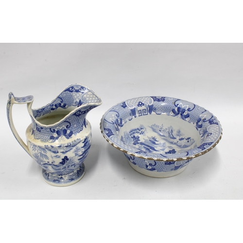 335 - Staffordshire pottery blue and white transfer printed jug and basin set (2) (a/f)