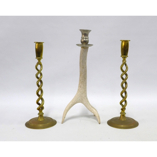 348 - A pair of brass spiral stem candlesticks and an antler candlestick (3) 35cm.