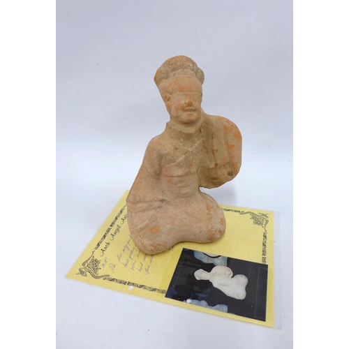 365 - Chinese carved  red stoneware tomb figure  with smiling expression