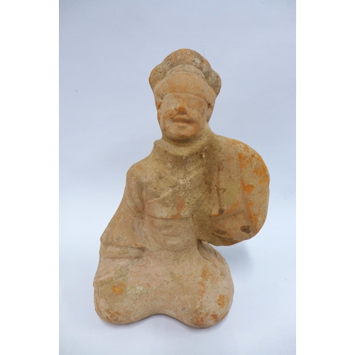 365 - Chinese carved  red stoneware tomb figure  with smiling expression