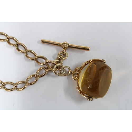 44 - 9 carat gold watch chain, circa 1911, with a 9ct T-bar and 9ct gold mounted citrine fob together wit... 