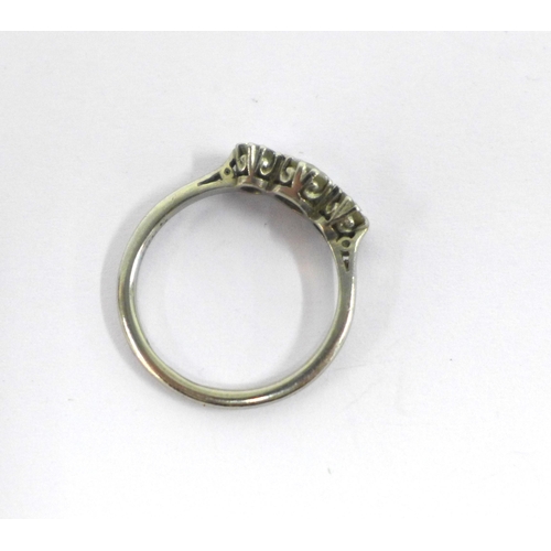 50 - Diamond three-stone ring, claw set with three old round-cut diamonds to a platinum band, stamped S&K... 