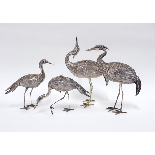 57 - A pair of Spanish silver Crane table figures, each with star standard mark tallest  24cm together wi... 