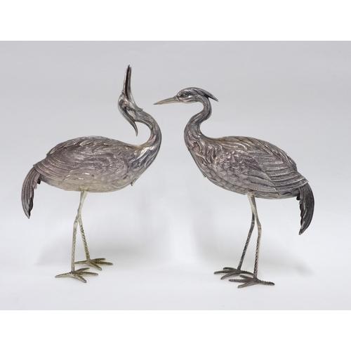 57 - A pair of Spanish silver Crane table figures, each with star standard mark tallest  24cm together wi... 