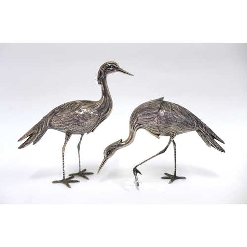 57 - A pair of Spanish silver Crane table figures, each with star standard mark tallest  24cm together wi... 