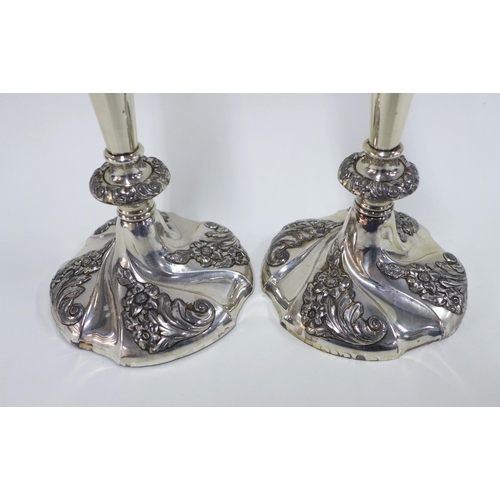 61 - A pair of silver plated knop stem candlesticks, (weighted base) (2) 26cm