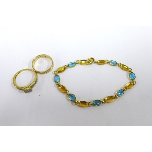 73 - 18ct gold bracelet, stamped 750 and two yellow metal rings, one with indistinct marks (3)