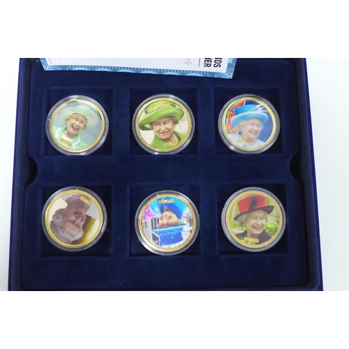 74 - Cased set of Gold Plated QEII commemorative coins - the Arthur Edwards Royal Photographer set, 2 tra... 