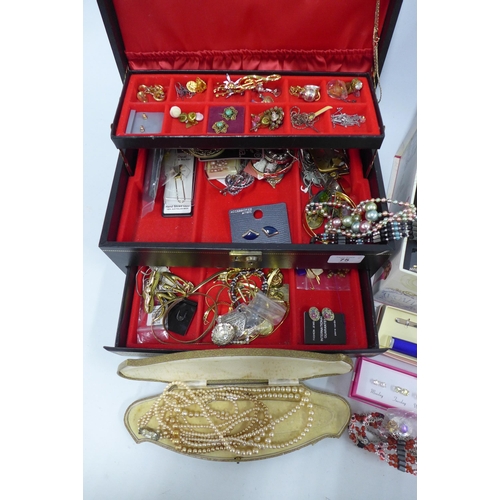 75 - Black leather jewellery box containing a quantity of vintage and later costume jewellery together wi... 