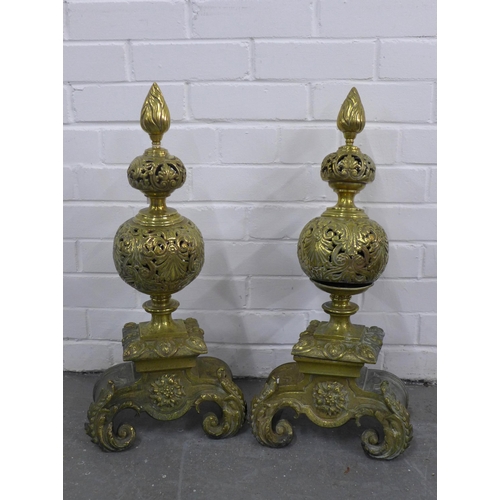 382 - Pair of antique brass fire dogs with pierced design and baroque style base, 62cm high (2)