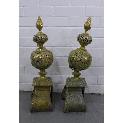 382 - Pair of antique brass fire dogs with pierced design and baroque style base, 62cm high (2)