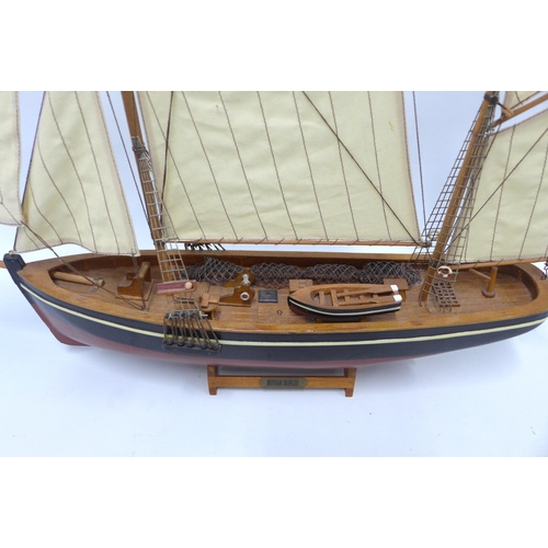 387 - Brixham Trailer model boat on stand, painted hull is approx 50cm long