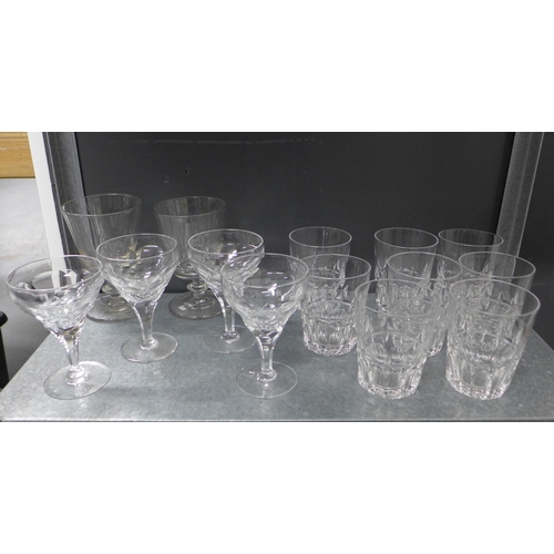 402 - A suite of facet cut stemware and other drinking glasses to include tumblers, rummers and wine glass... 