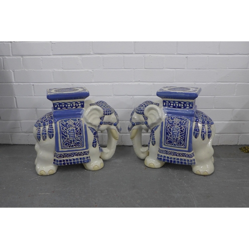 404 - A pair of blue and white pottery elephant veranda stools (2)