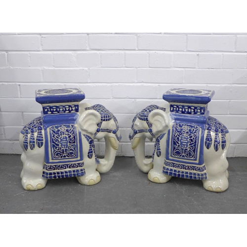 404 - A pair of blue and white pottery elephant veranda stools (2)