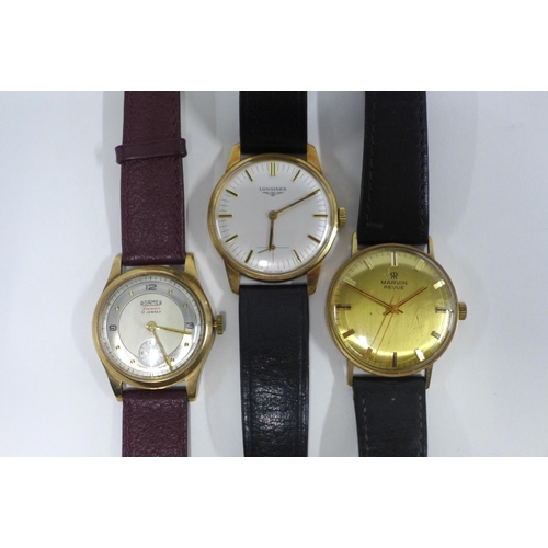 100A - Three Gents wristwatches to include 9ct gold cased Roamer wristwatch, 9ct gold cased Longines and a ... 